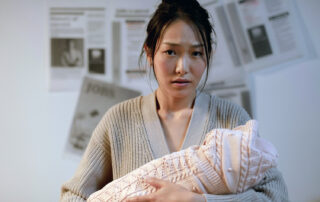 a woman with depression holding her baby