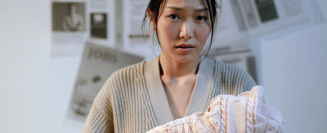 a woman with depression holding her baby